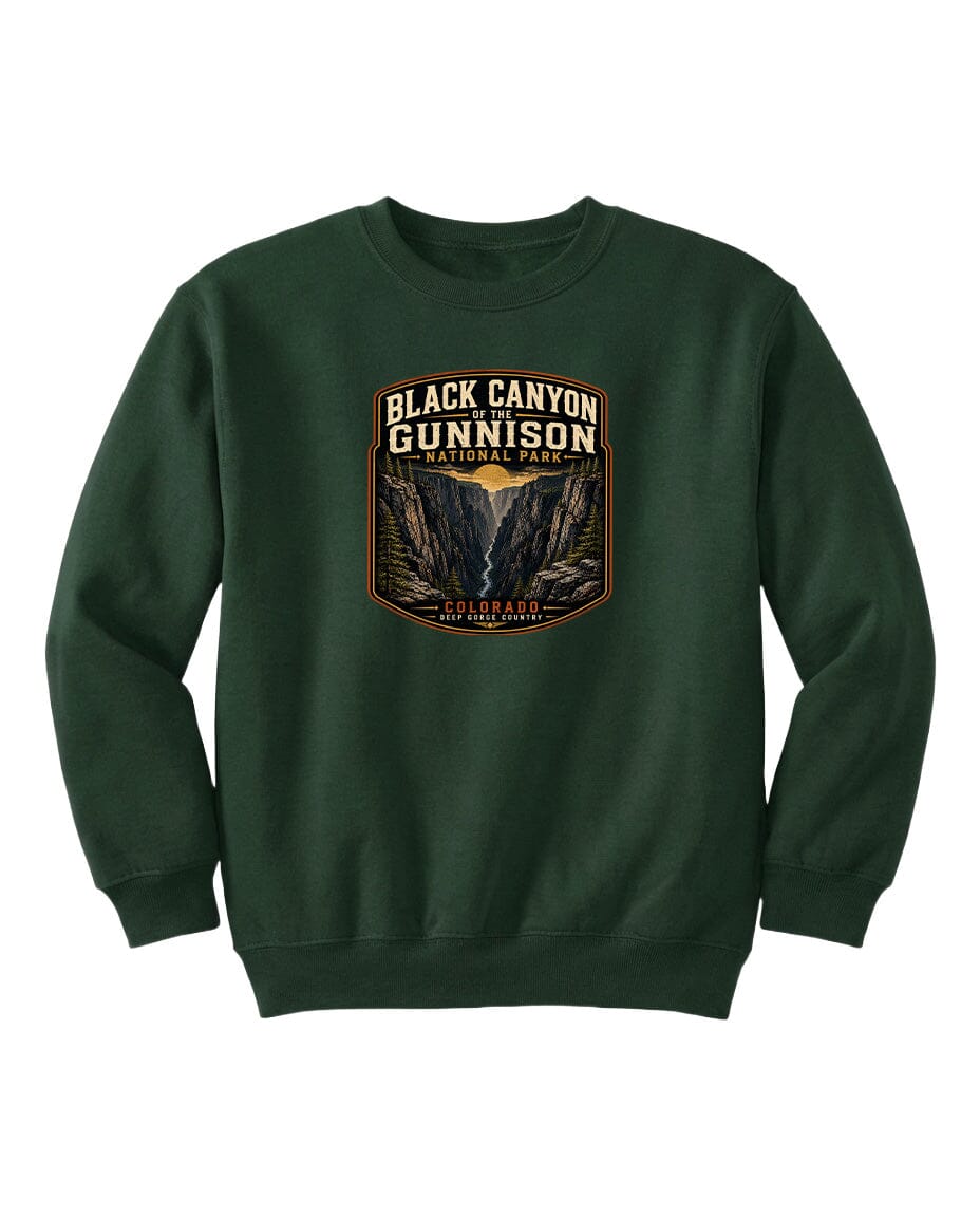A green sweatshirt with a graphic design featuring the text "Black Canyon Gunnison National Park" and an illustration of a canyon.