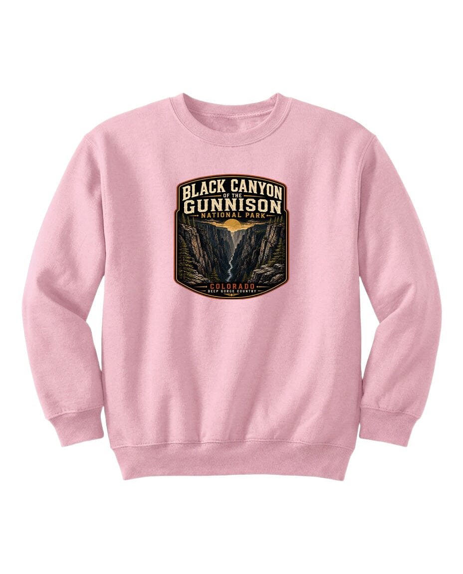 A pink sweatshirt with a graphic design depicting the Black Canyon of the Gunnison National Park.