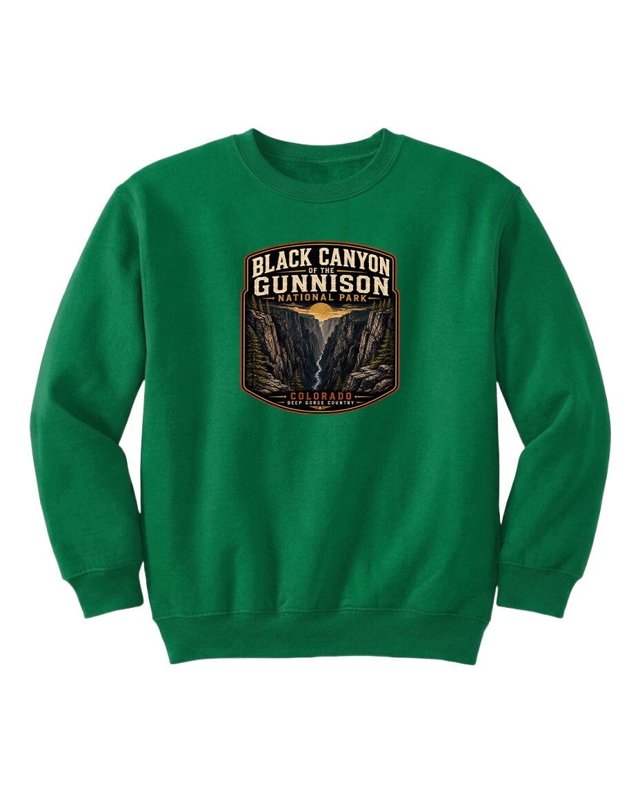 A green sweatshirt with a graphic design featuring the text "Black Canyon Gunnison National Park" and an illustration of a canyon.