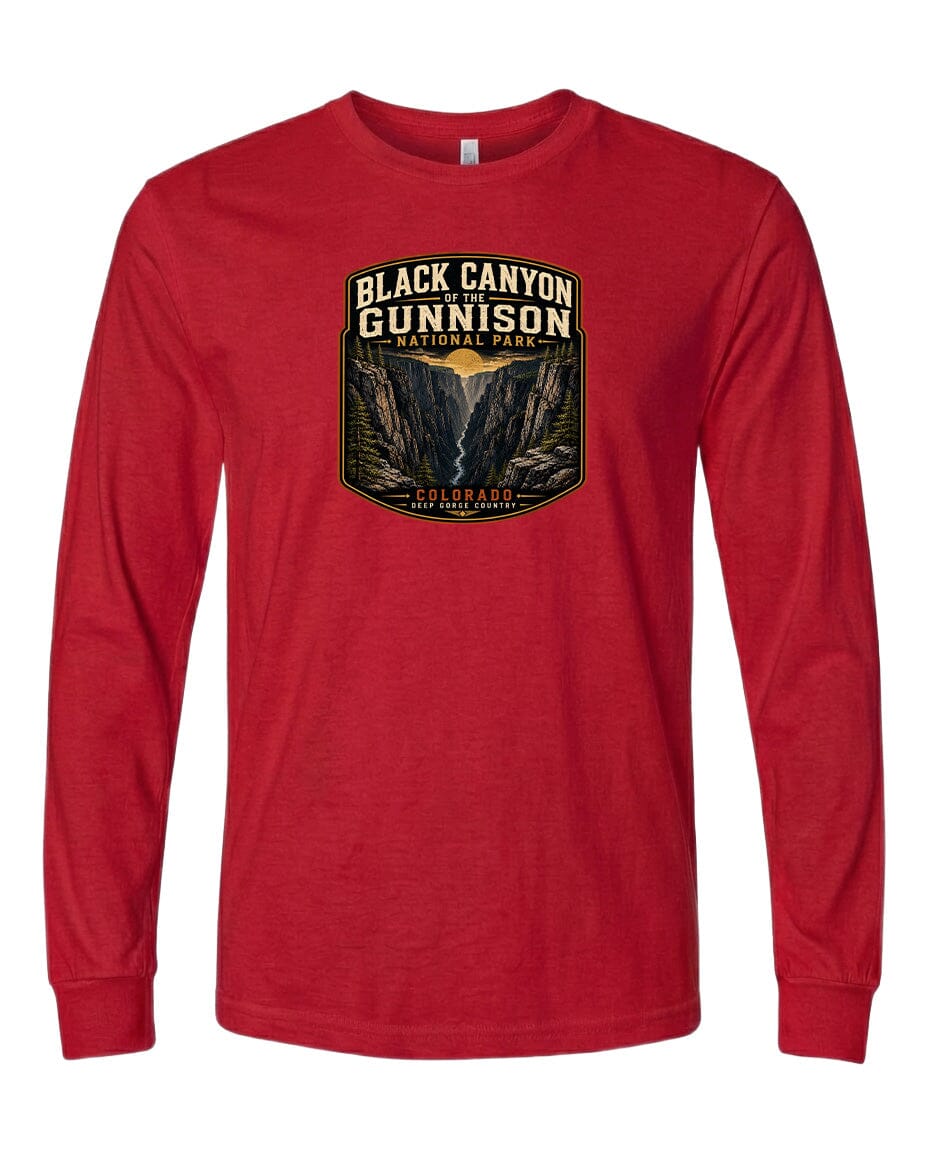 A red long-sleeved t-shirt with a graphic design depicting the Black Canyon of the Gunnison National Park.