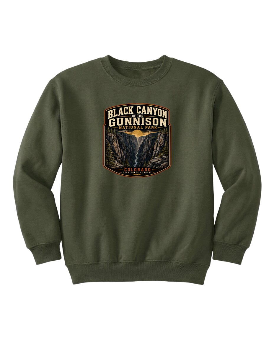 A green sweatshirt with a graphic design featuring the text "Black Canyon Gunnison National Park" and an illustration of a canyon.