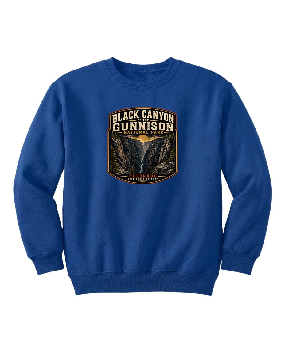 A blue sweatshirt with a graphic design featuring the text "Black Canyon Gunnison National Park" and an illustration of a canyon.