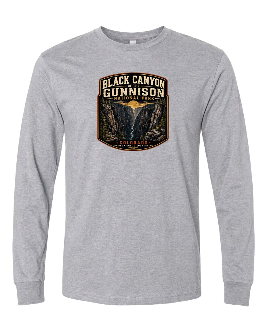 A gray long-sleeved t-shirt with a graphic design depicting a scenic mountain landscape, including a valley and a river.