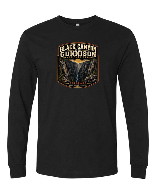 A black long-sleeve t-shirt with a graphic design depicting the Black Canyon of the Gunnison National Park in Colorado.