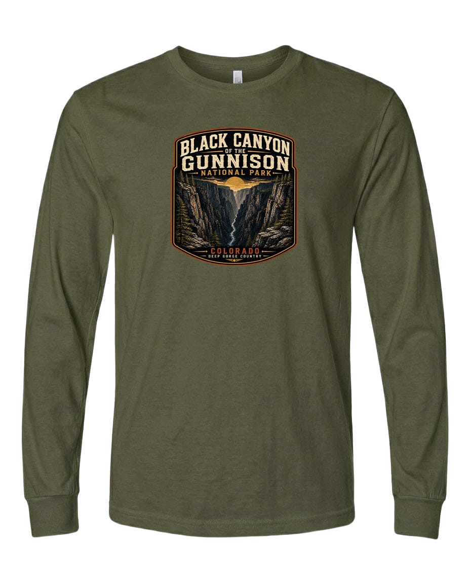 A long-sleeved olive green t-shirt with a graphic design depicting a mountainous landscape, specifically the Black Canyon of the Gunnison National Park in Colorado.
