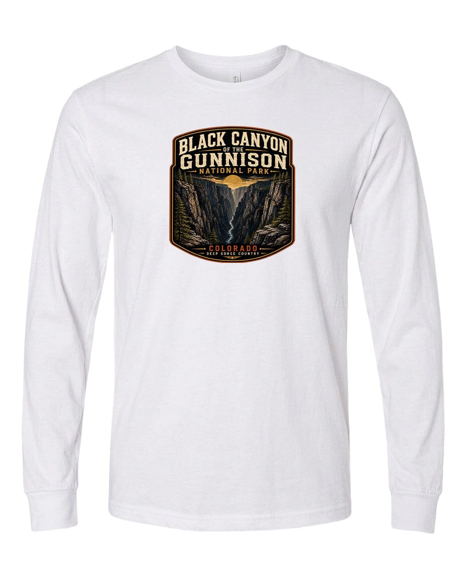 A white long-sleeved t-shirt with a graphic design depicting the Black Canyon of the Gunnison National Park in Colorado.