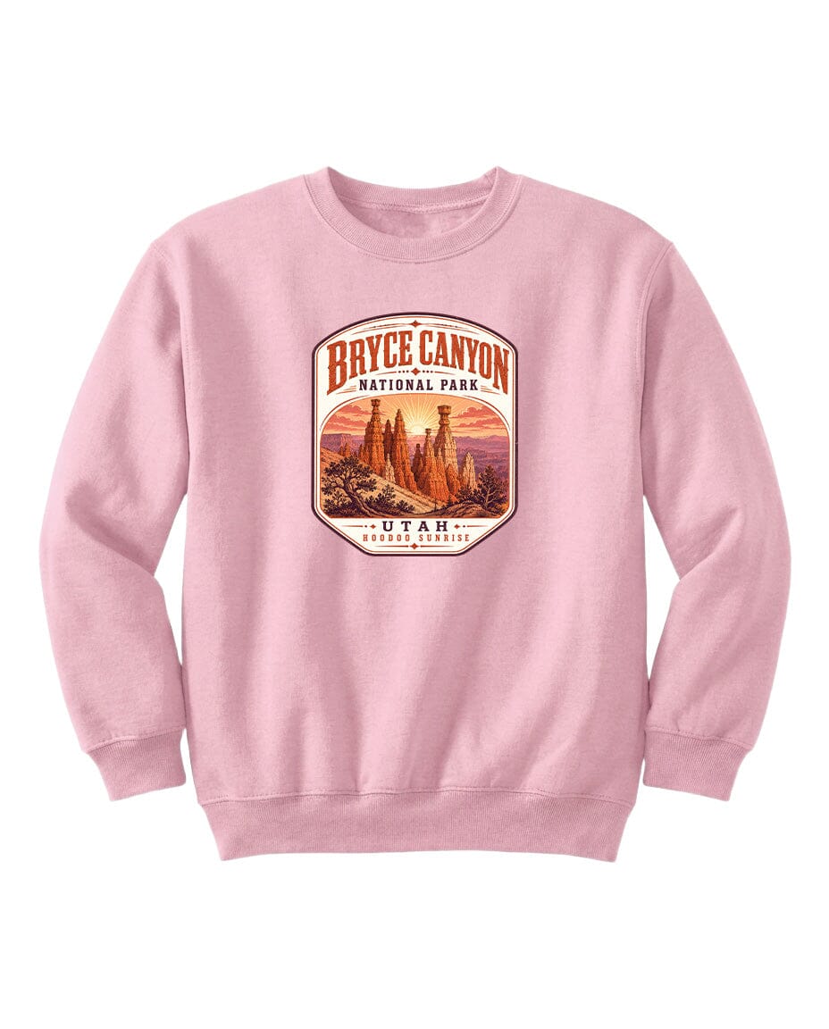 A pink sweatshirt with a graphic design depicting Bryce Canyon National Park and Utah.
