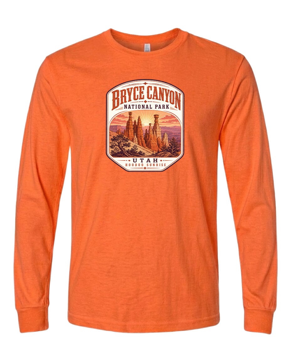 a long-sleeved orange t-shirt with a graphic design depicting the Bryce Canyon National Park in Utah.