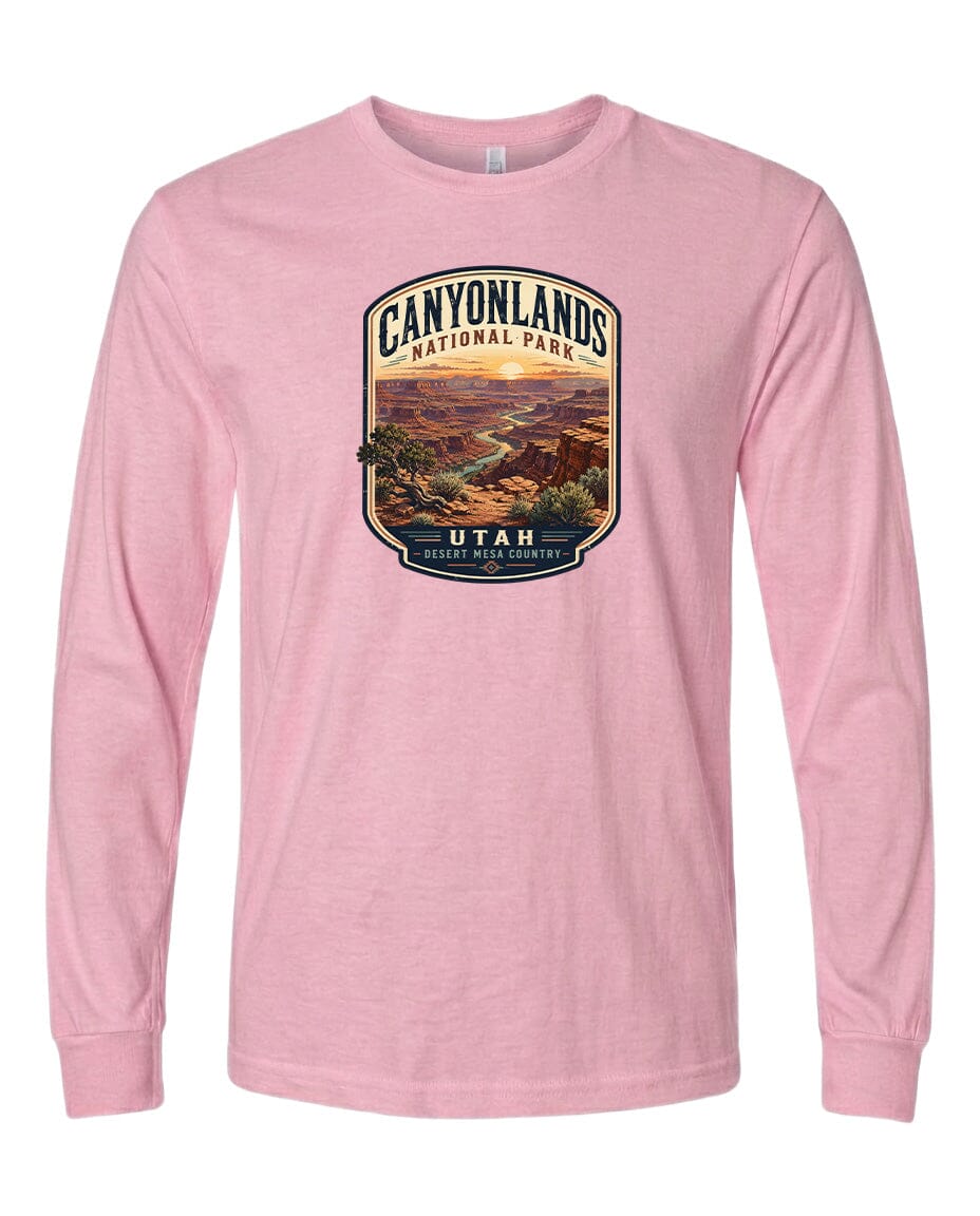 A pink long-sleeved t-shirt with a graphic design depicting the scenic landscape of Canyonlands National Park in Utah.