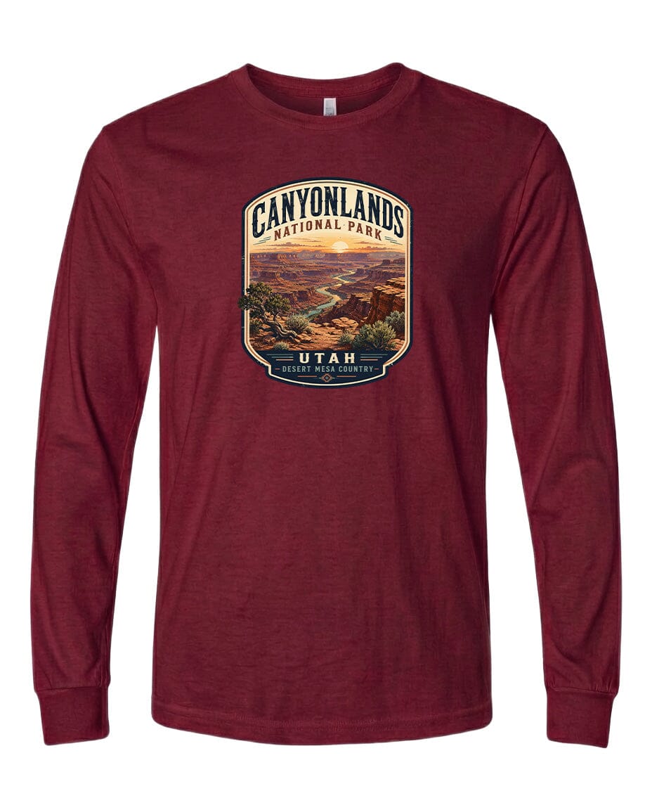 A red long-sleeved t-shirt with a graphic design depicting a scenic landscape of the Canyons National Park in Utah.