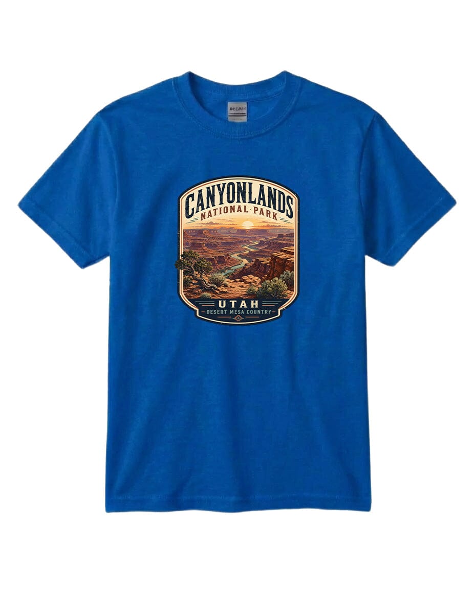 A blue t-shirt with a graphic design depicting a scenic landscape, including mountains, a river, and a desert landscape.