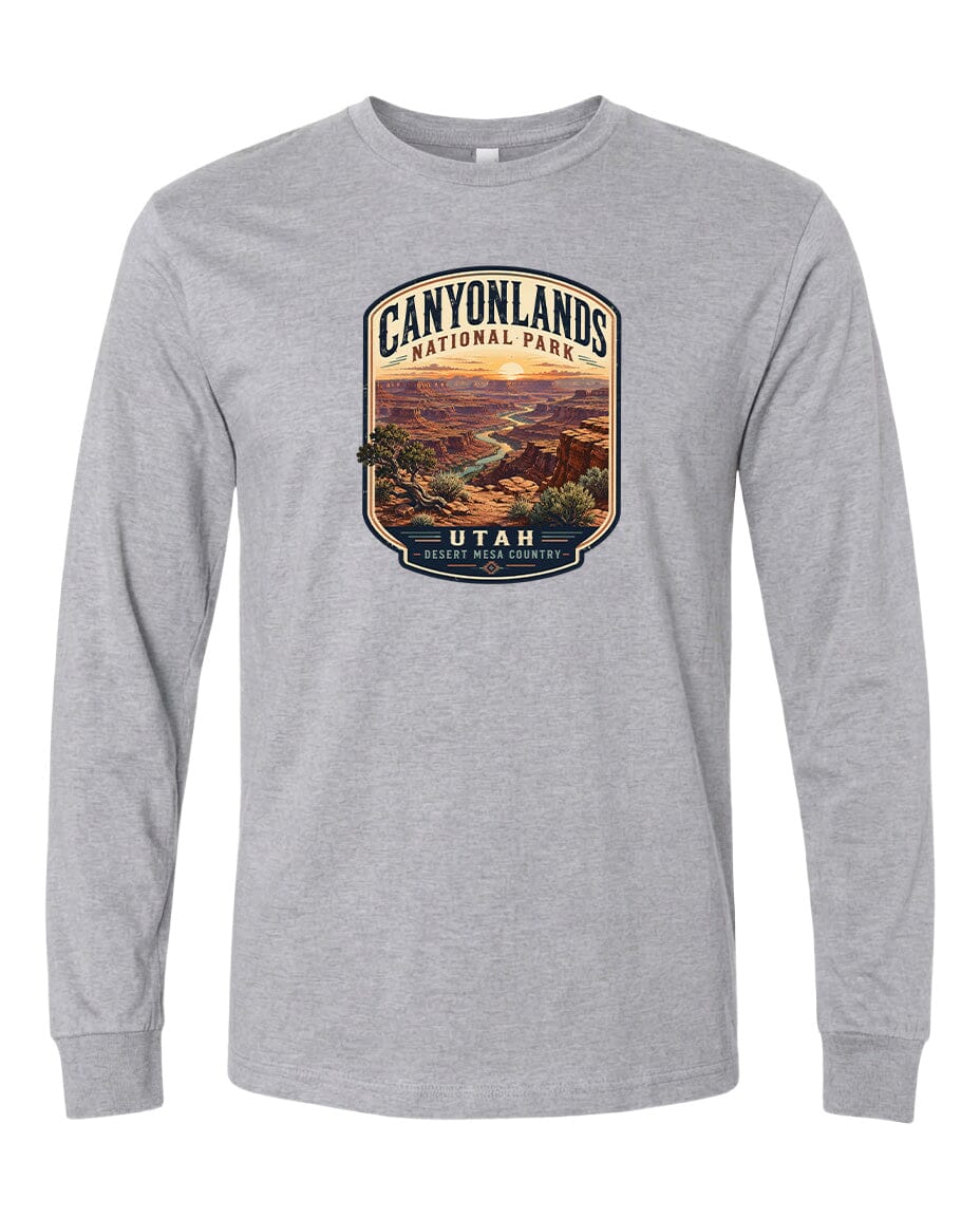 A gray long-sleeved t-shirt with a graphic design depicting a scenic landscape of the Canyons National Park in Utah.