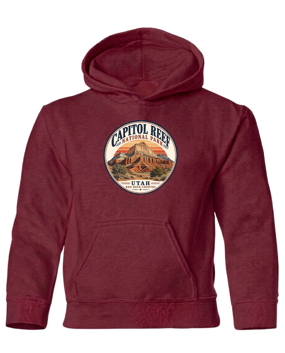 A red hooded sweatshirt with a circular logo on the front that says "CAPITOL REEF NATIONAL PARK UTAH".
