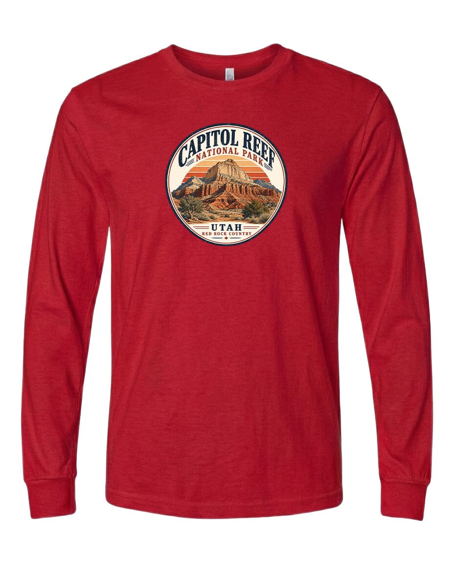 A red long-sleeved t-shirt with a circular design featuring the Capitol Reef National Park in Utah.
