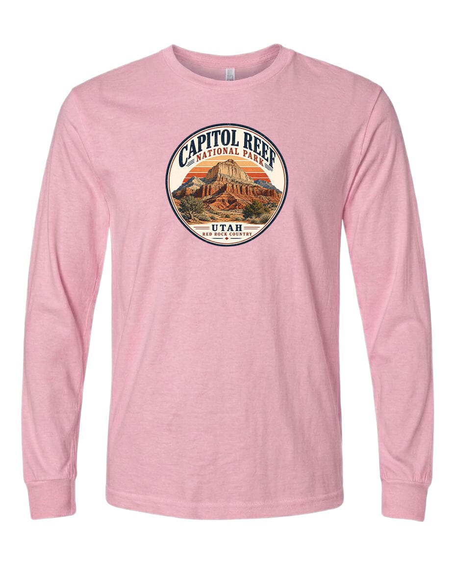 A pink long-sleeved t-shirt with a circular graphic design featuring the Capitol Reef National Park in Utah.