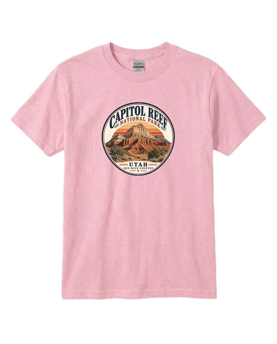 A pink t-shirt with a circular graphic design featuring the Capitol Reef National Park in Utah.