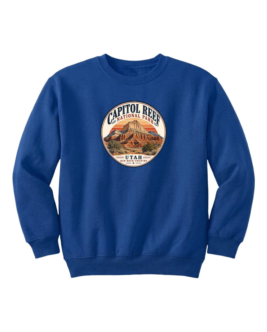 A blue sweatshirt with a circular design featuring the Capitol Reef National Park logo and the text "UTAH" printed on it.