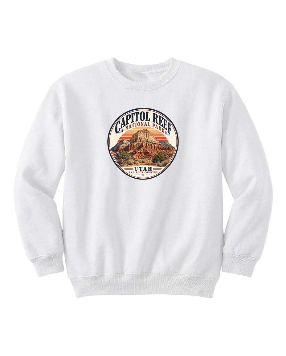A white sweatshirt with a circular design featuring the Capitol Reef National Park logo and the text "UTAH" printed on it.