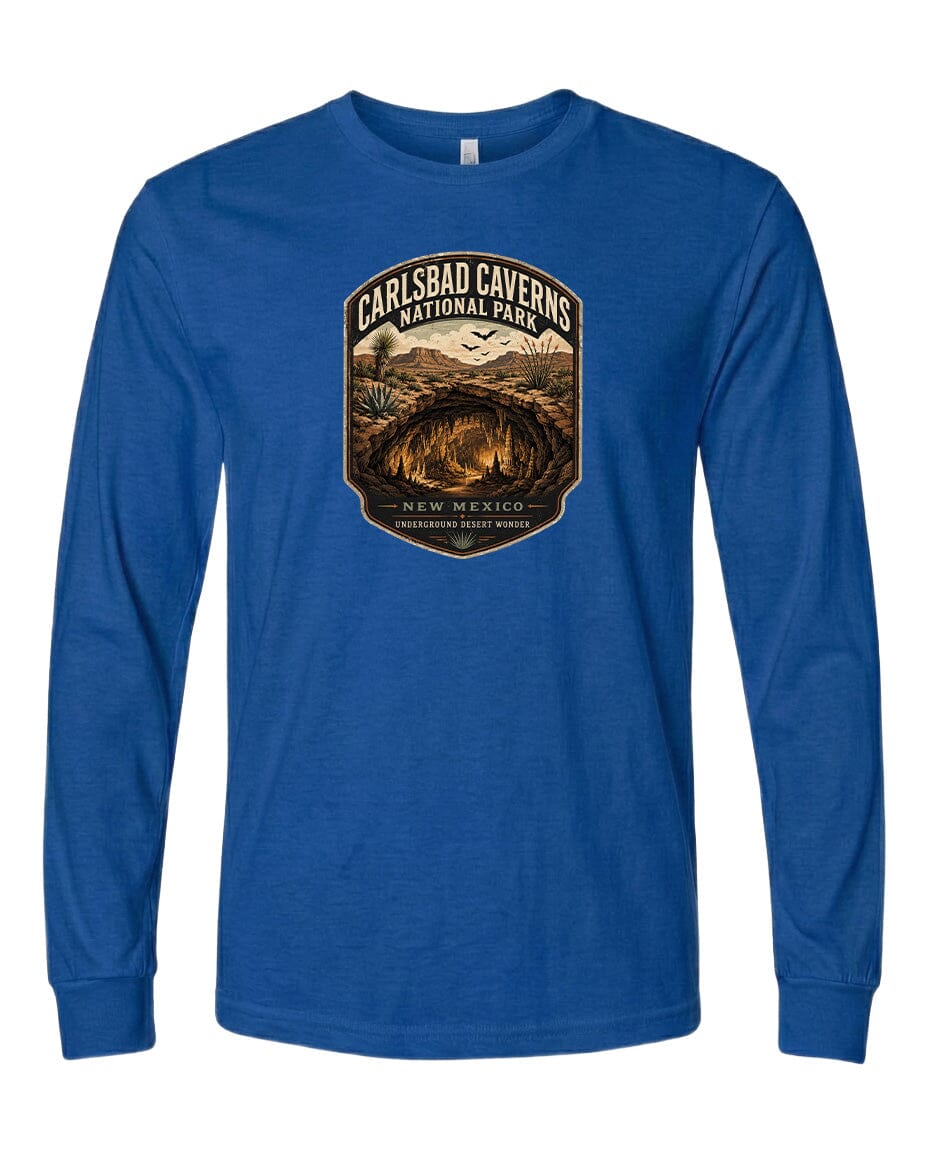 A blue long-sleeved t-shirt with a graphic design depicting the Carlsbad Caves National Park in New Mexico.
