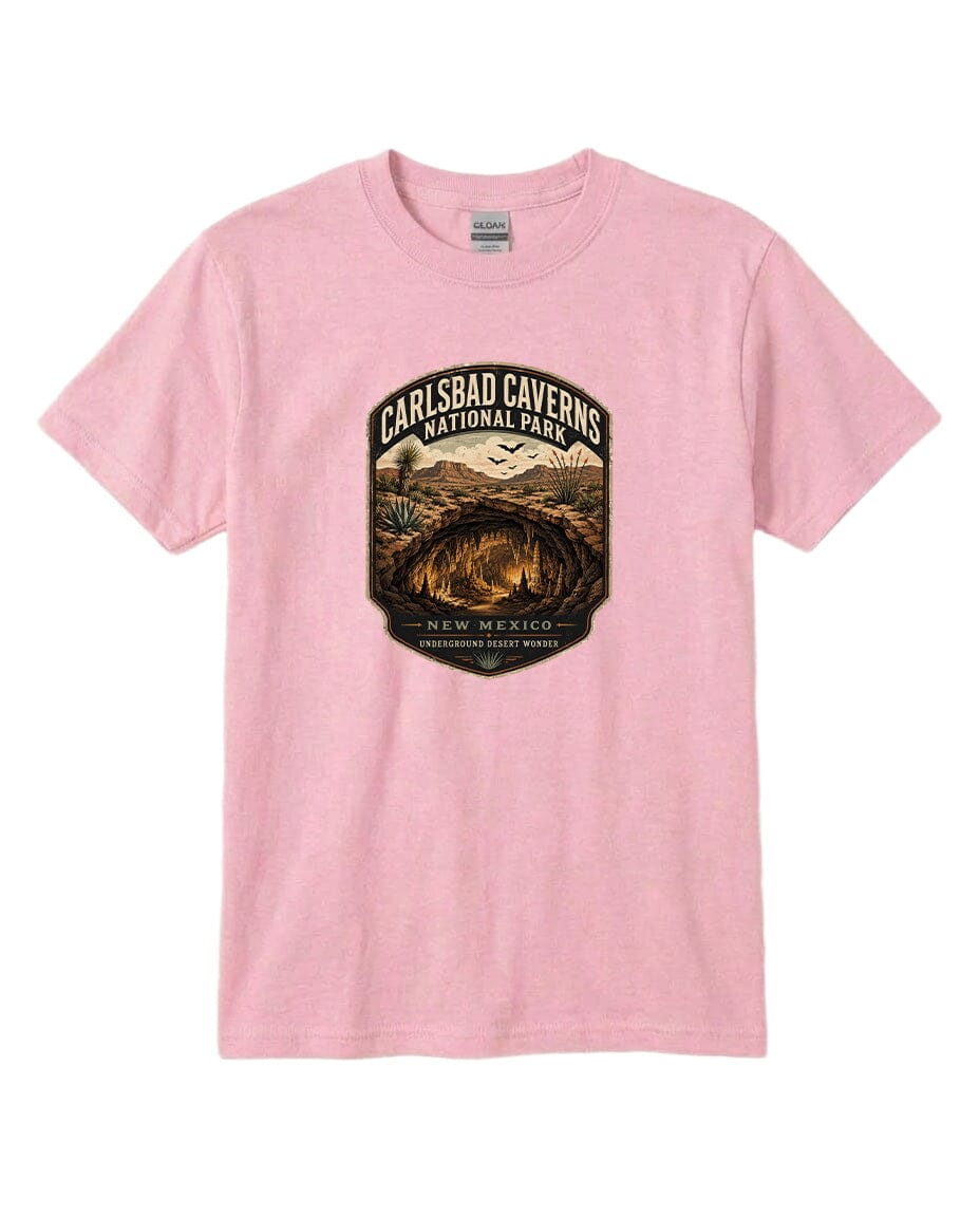 A pink t-shirt with a graphic design depicting the entrance to the Carlsbad Caverns National Park in New Mexico.