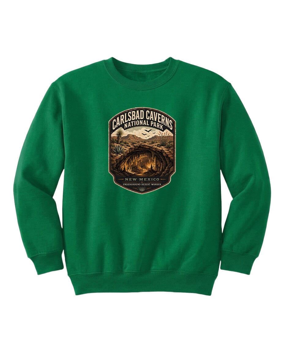 A green sweatshirt with a graphic design featuring the entrance to the Carlsbad Caverns National Park in New Mexico.
