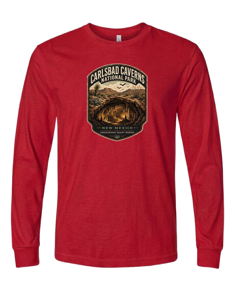 A red long-sleeved t-shirt with a graphic design depicting the Carlsbad Caves National Park in New Mexico.