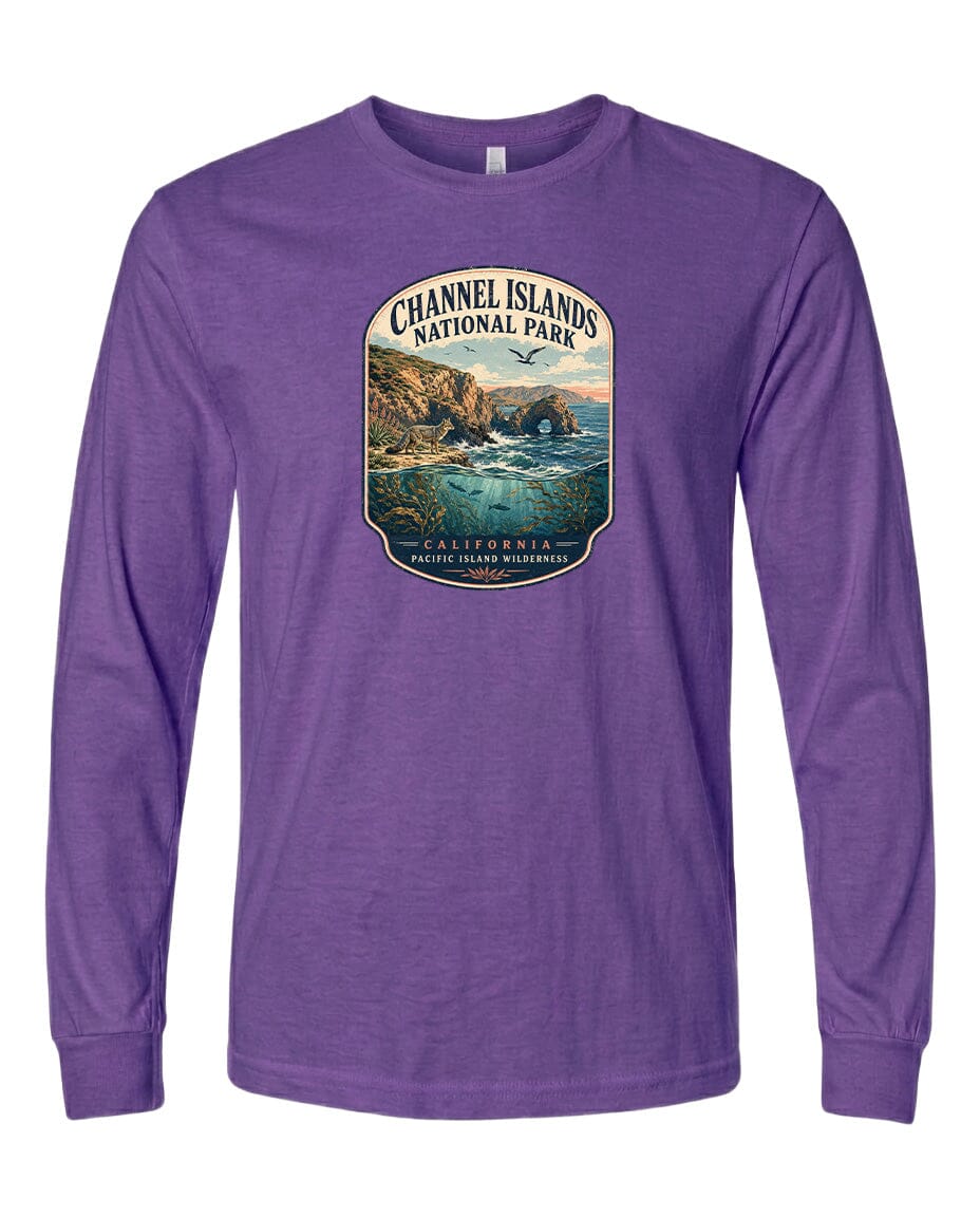 A purple long-sleeved t-shirt with a graphic design depicting a scenic coastal landscape, including cliffs, water, and a sunset.