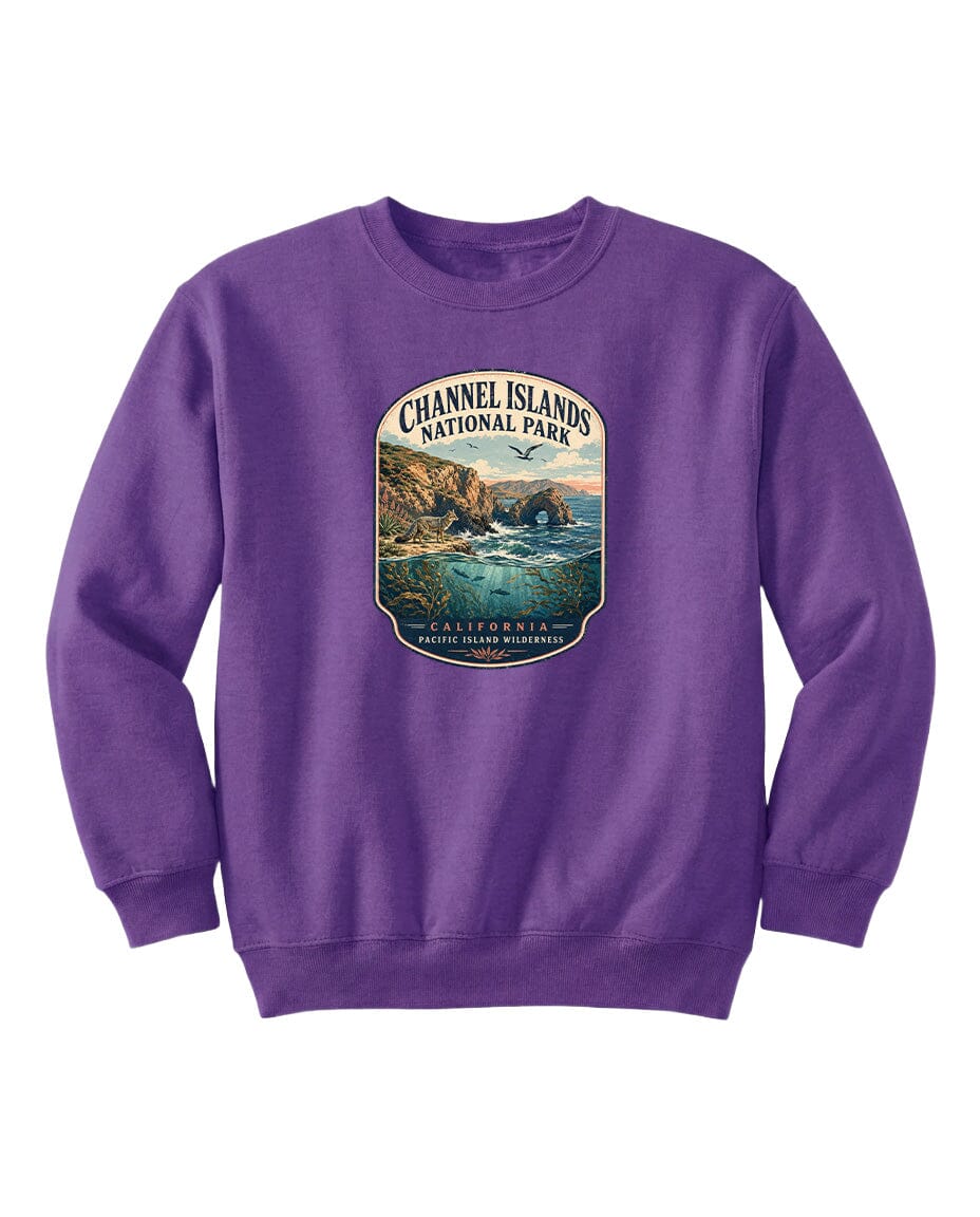 A purple sweatshirt with a graphic design depicting a scenic coastal landscape, including cliffs, water, and a sunset.