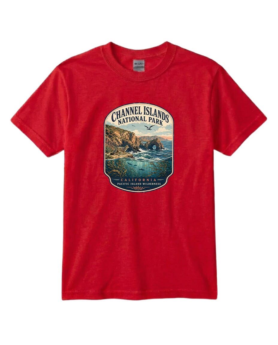 A red t-shirt with a graphic design depicting a scenic coastal landscape, including cliffs, water, and a bird in flight.