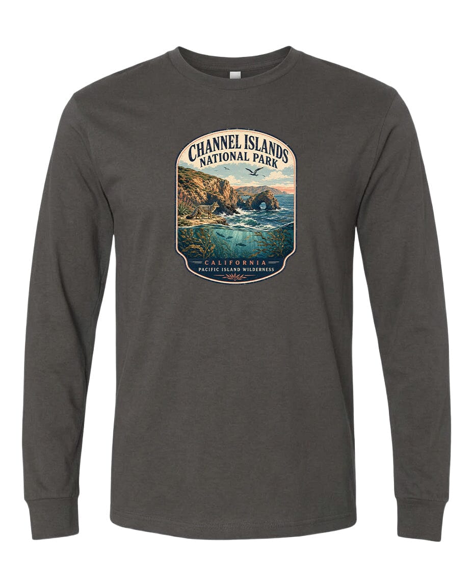 A gray long-sleeved t-shirt with a graphic design depicting a scenic coastal landscape, including cliffs, water, and a sunset.