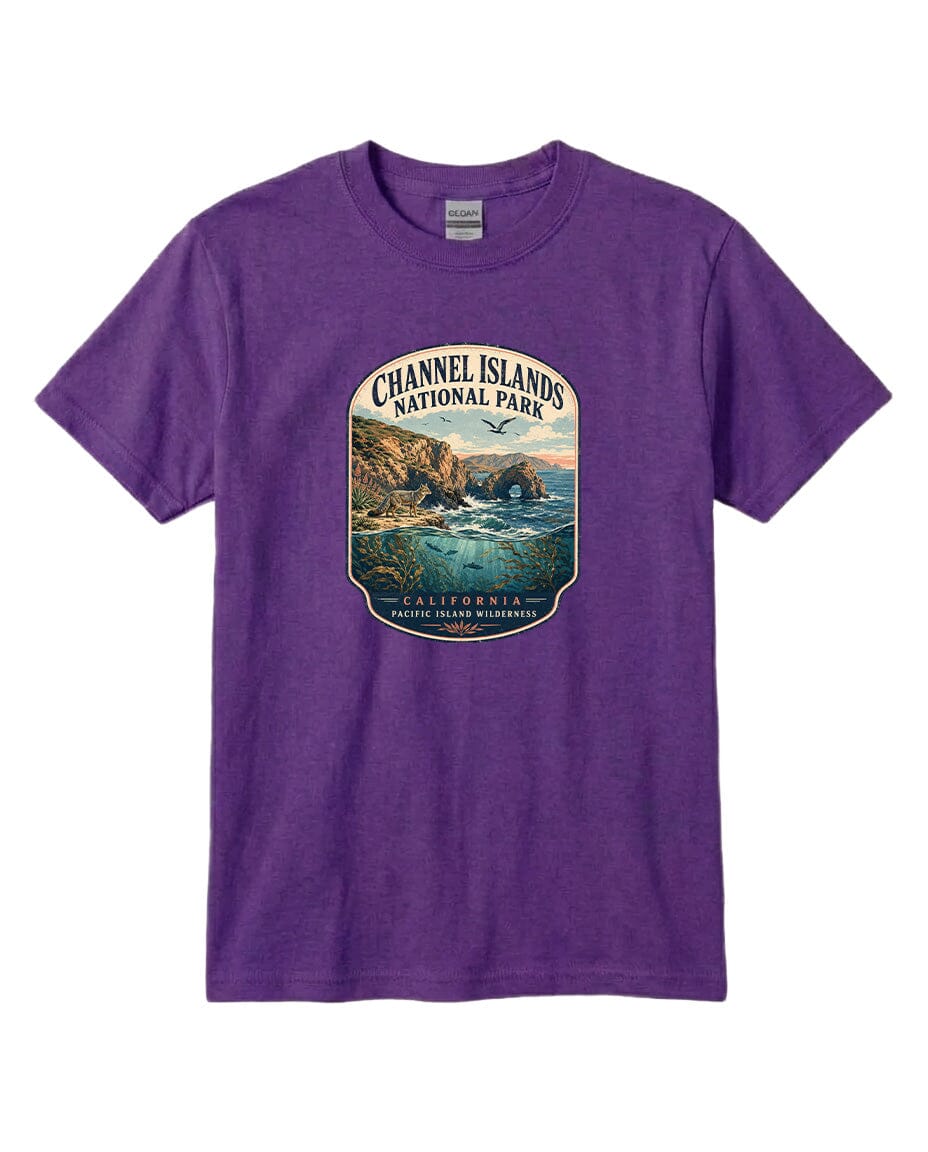 A purple t-shirt with a graphic design depicting a scenic coastal landscape, including cliffs, water, and a bird in flight.