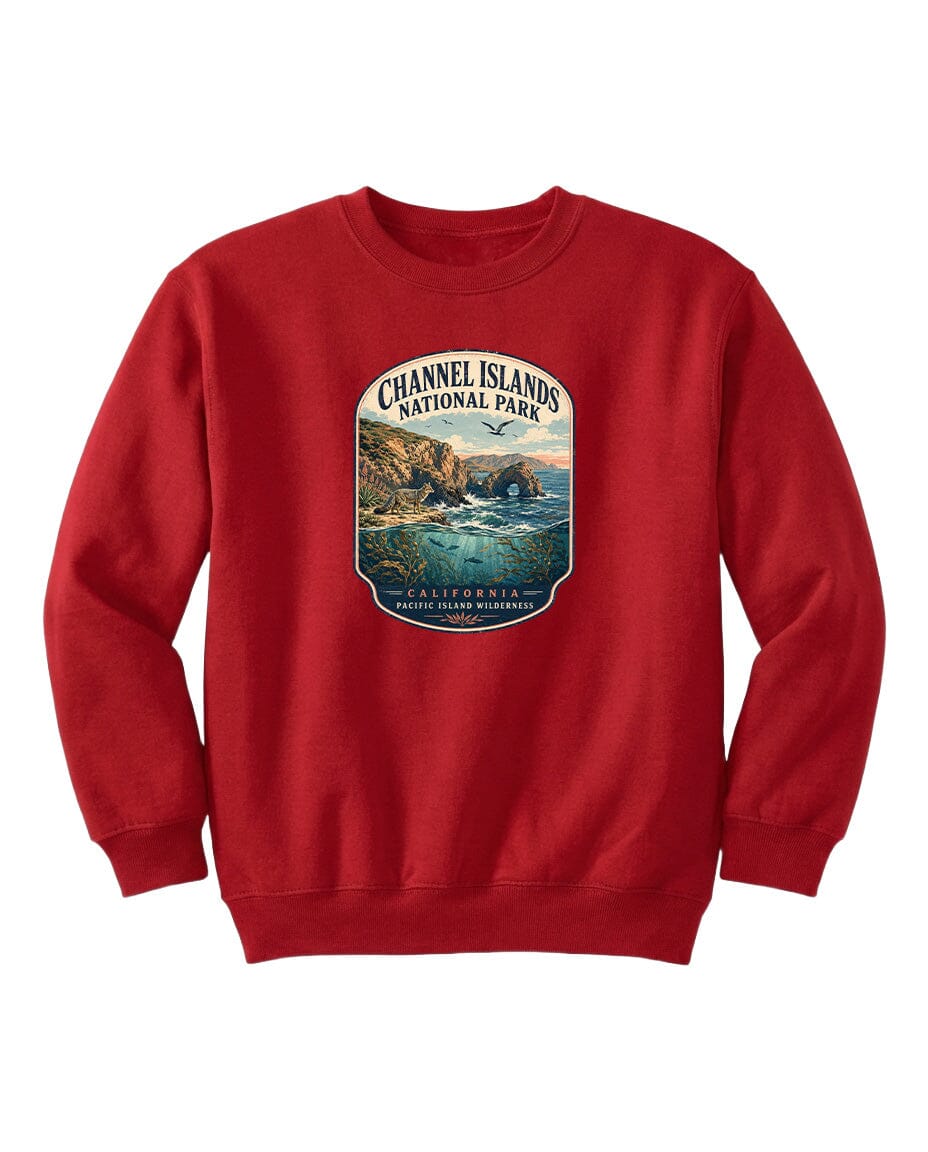 A red sweatshirt with a graphic design depicting a scenic coastal landscape, including cliffs, water, and a sunset.