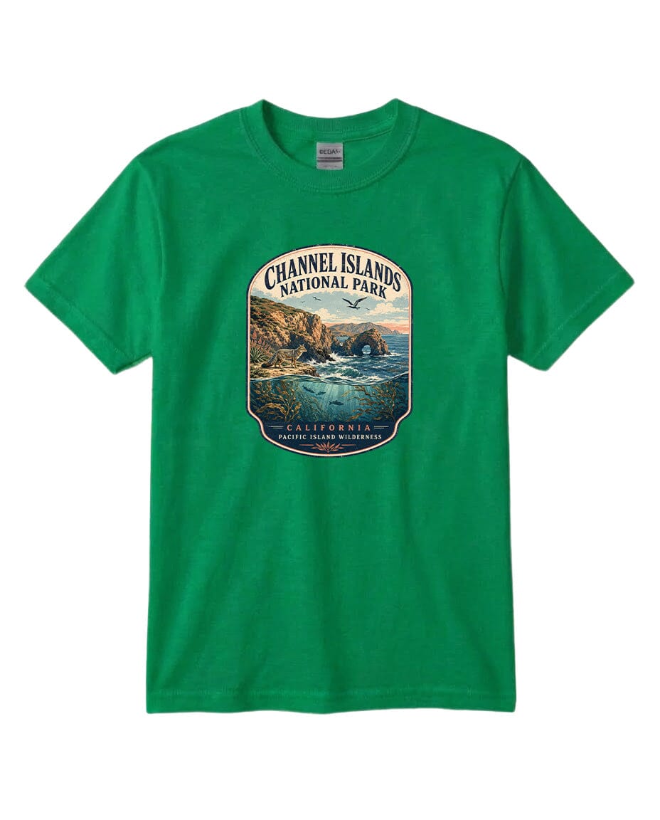 A green t-shirt with a graphic design depicting a scenic coastal landscape with cliffs, water, and a bird in flight.