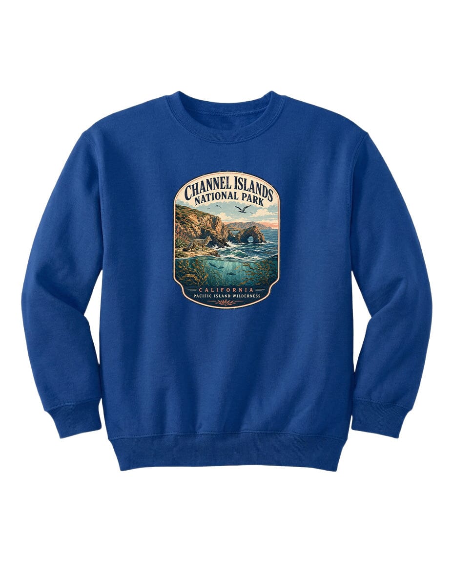 A blue sweatshirt with a graphic design depicting a scenic coastal landscape, including cliffs, water, and a sunset.