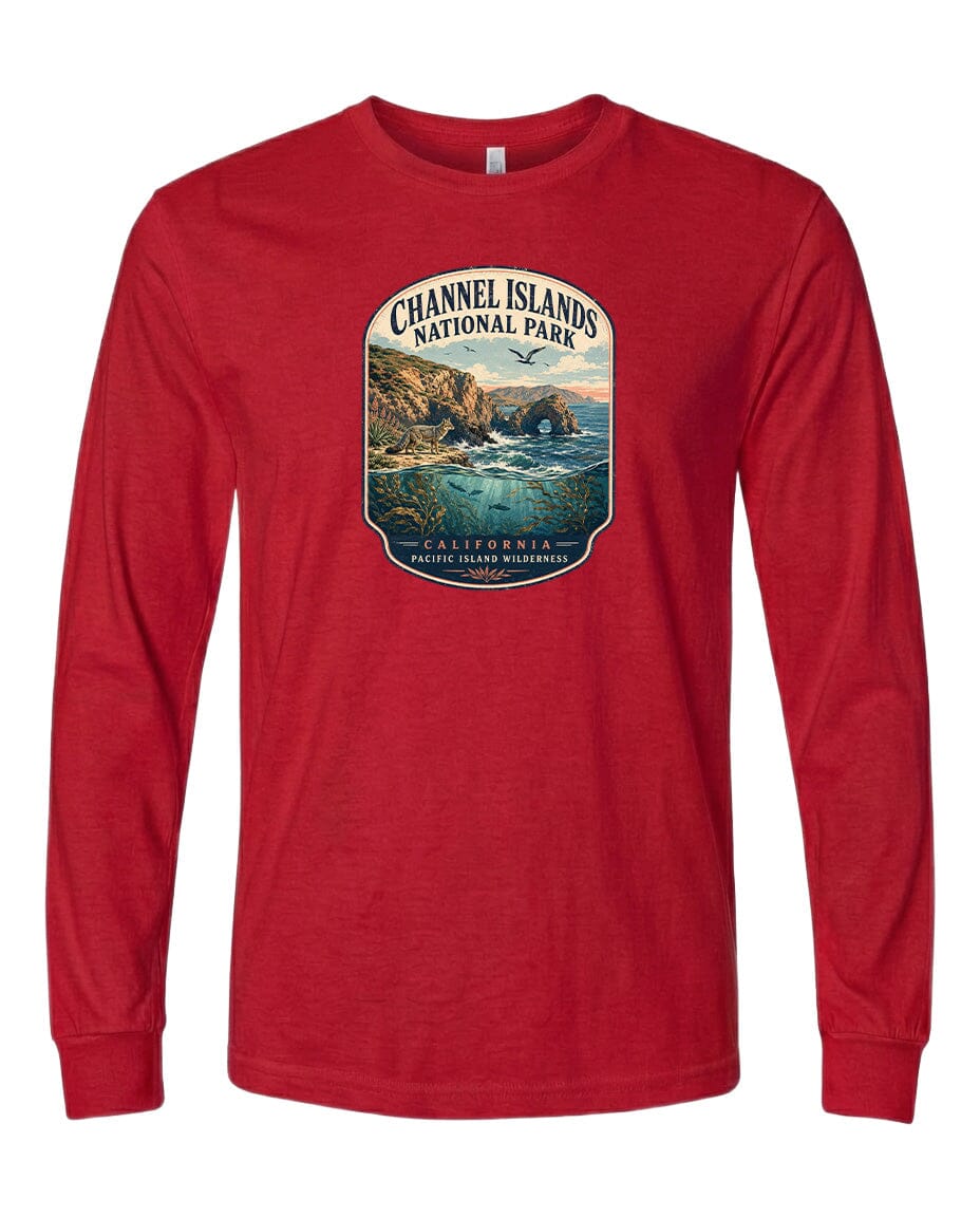 A red long-sleeved t-shirt with a graphic design depicting a scenic coastal landscape, including cliffs, water, and a beach.