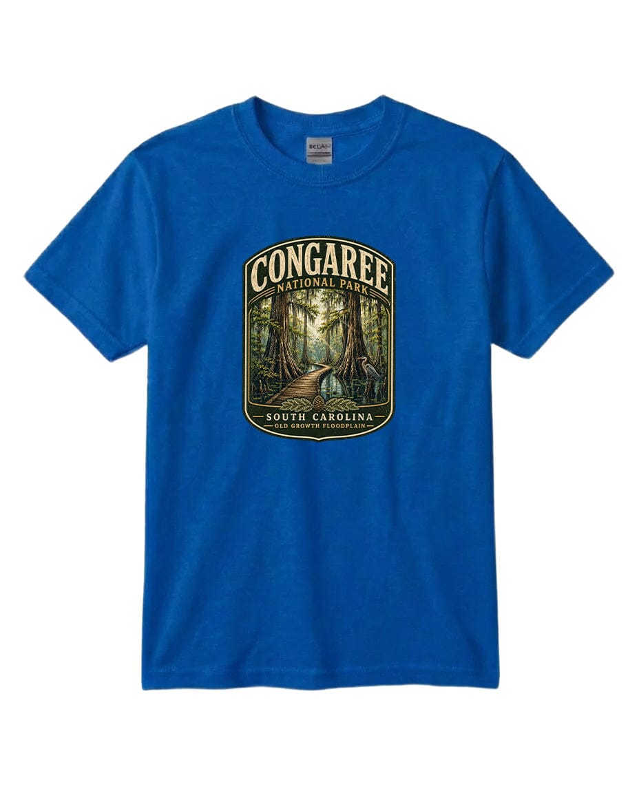 A blue t-shirt with a graphic design depicting a forest scene with a path leading through it, surrounded by trees.