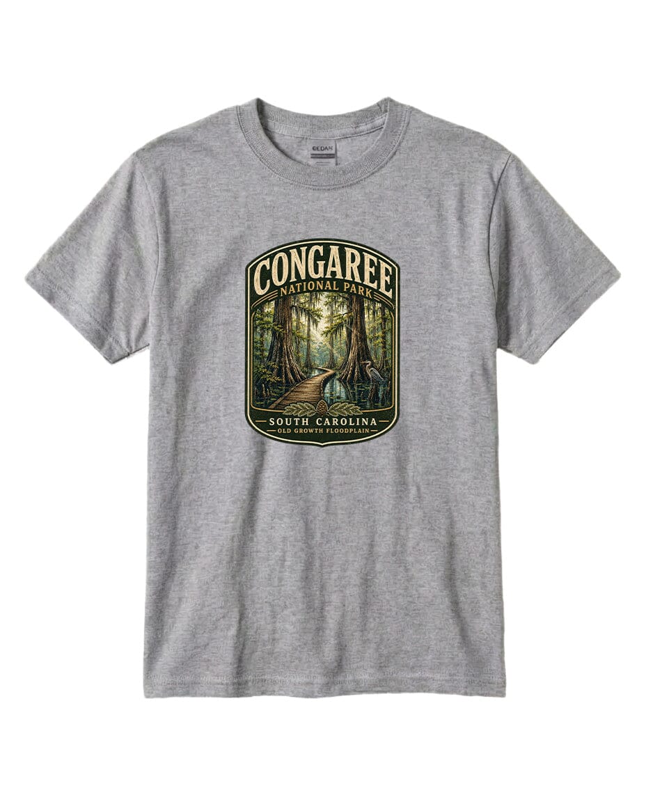 A gray t-shirt with a graphic design depicting a forest scene with a path leading through it, surrounded by trees and foliage.