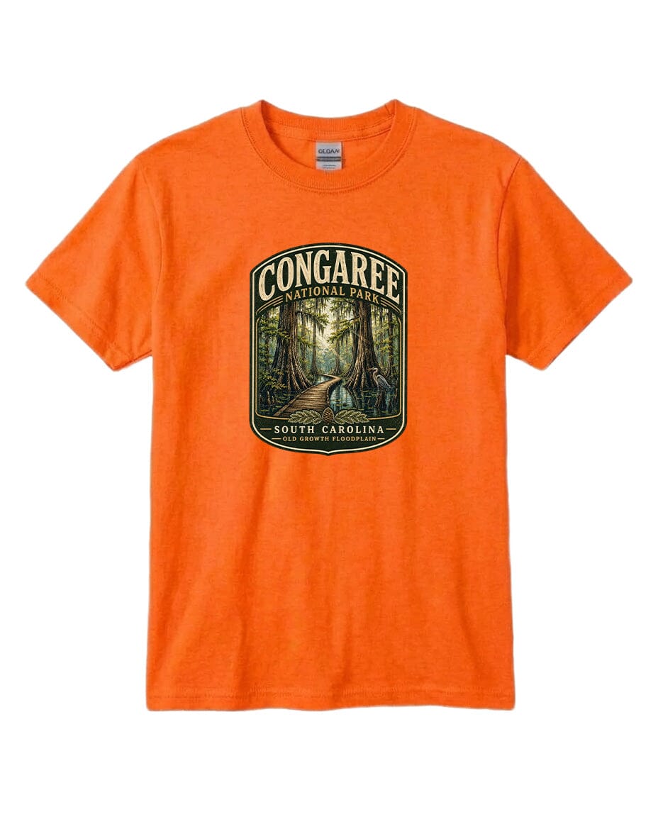 An orange t-shirt with a graphic design depicting a forest scene with a path leading through it, surrounded by trees.