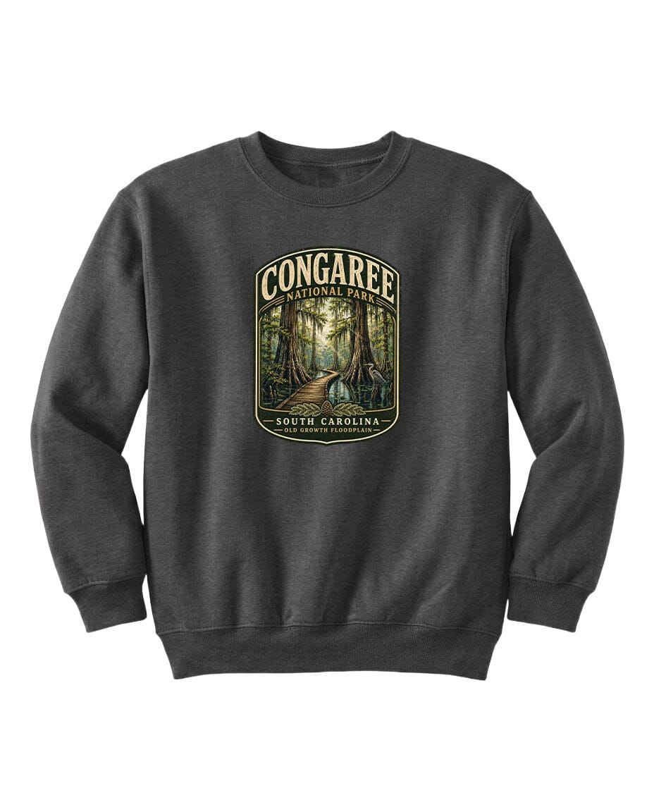 A gray sweatshirt with a graphic design depicting a forest scene, featuring the text "CONGAREE NATIONAL PARK SOUTH CAROLINA" prominently displayed.