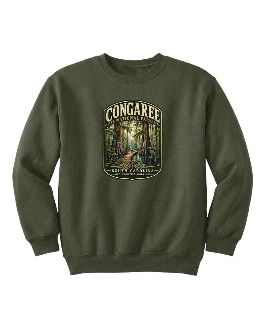 A green sweatshirt with a graphic design depicting a forest scene, featuring the text "CONGAREE NATIONAL PARK SOUTH CAROLINA" prominently displayed.