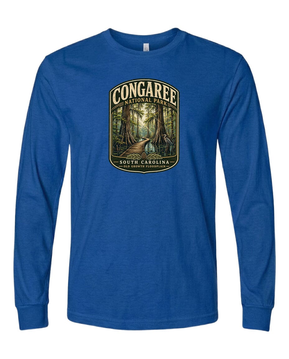 A blue long-sleeved t-shirt with a graphic design depicting a forest scene, featuring a path leading through the trees.