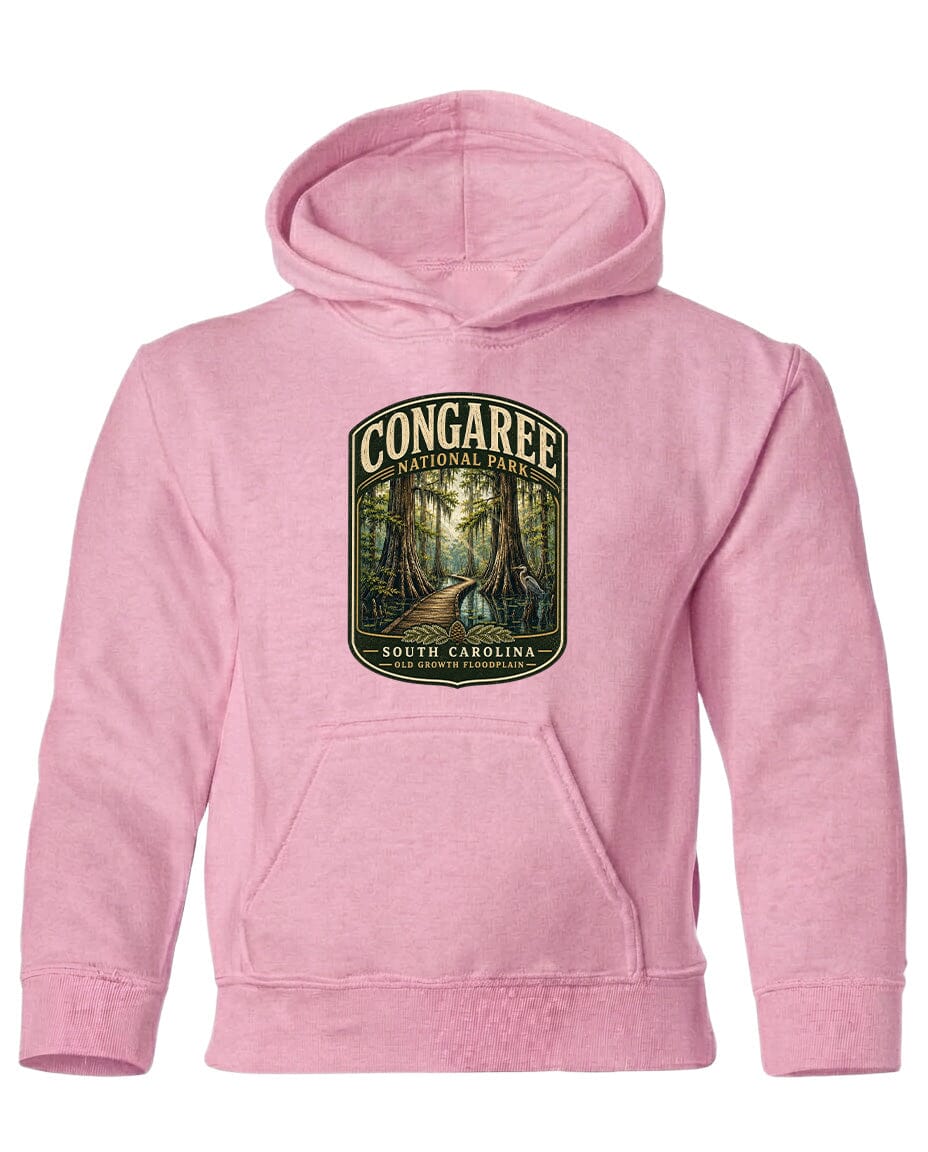 A pink hoodie with a graphic design depicting a forest scene and the text "CONGAREE NATIONAL PARK SOUTH CAROLINA" printed on it.