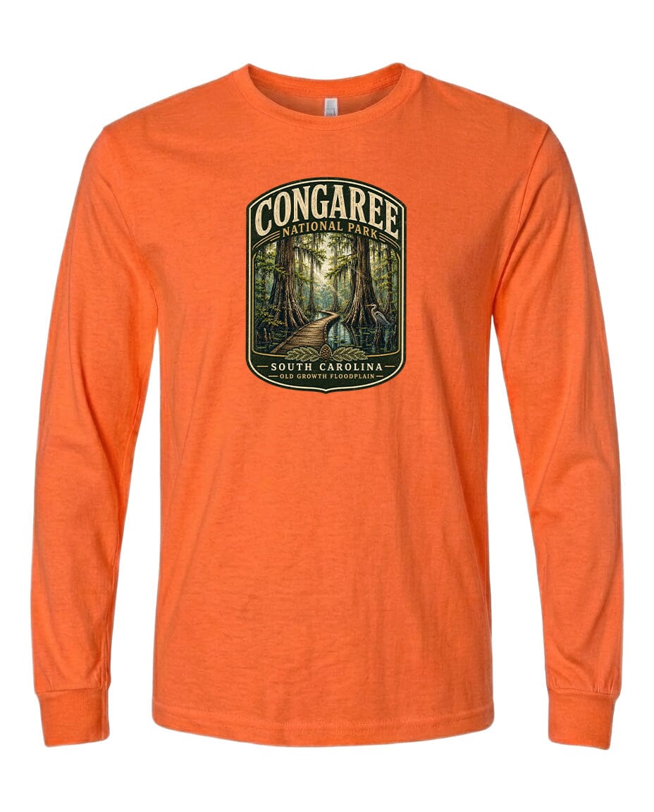 An orange long-sleeved t-shirt with a graphic design depicting a forest scene, specifically Congaree National Park in South Carolina.