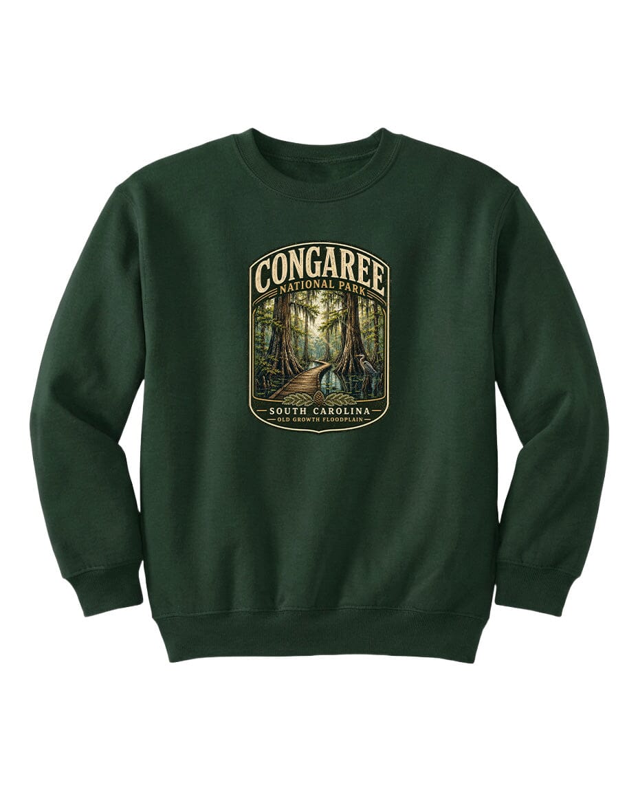 A green sweatshirt with a graphic design depicting a forest scene, featuring the text "CONGAREE NATIONAL PARK SOUTH CAROLINA" prominently displayed.