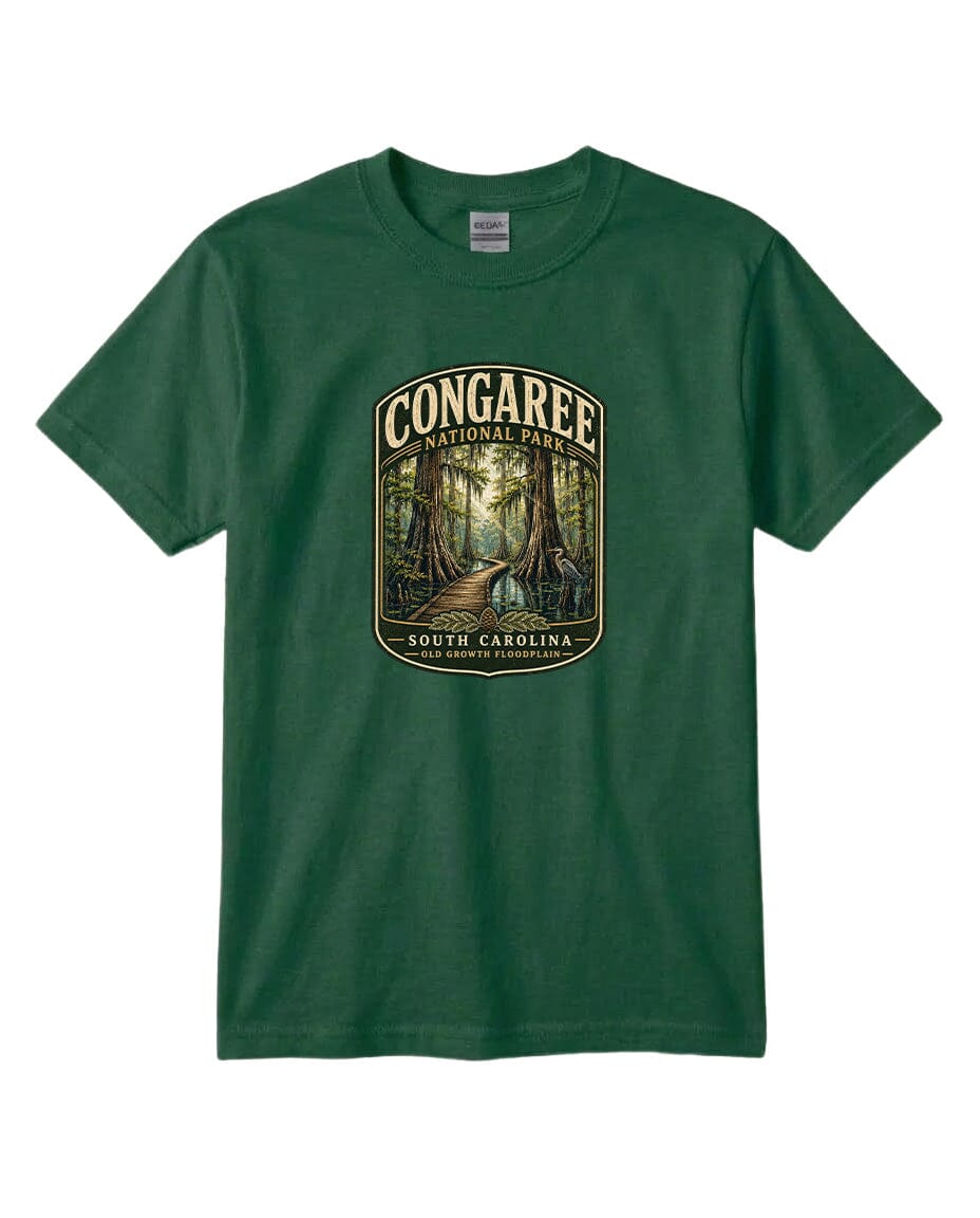 A green t-shirt with a graphic design depicting a forest scene with a path leading through it, surrounded by trees.