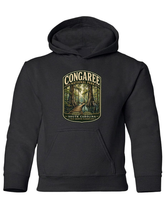 A black hooded sweatshirt with a graphic design depicting a forest scene and the text "CONGAREE NATIONAL PARK SOUTH CAROLINA" printed on it.