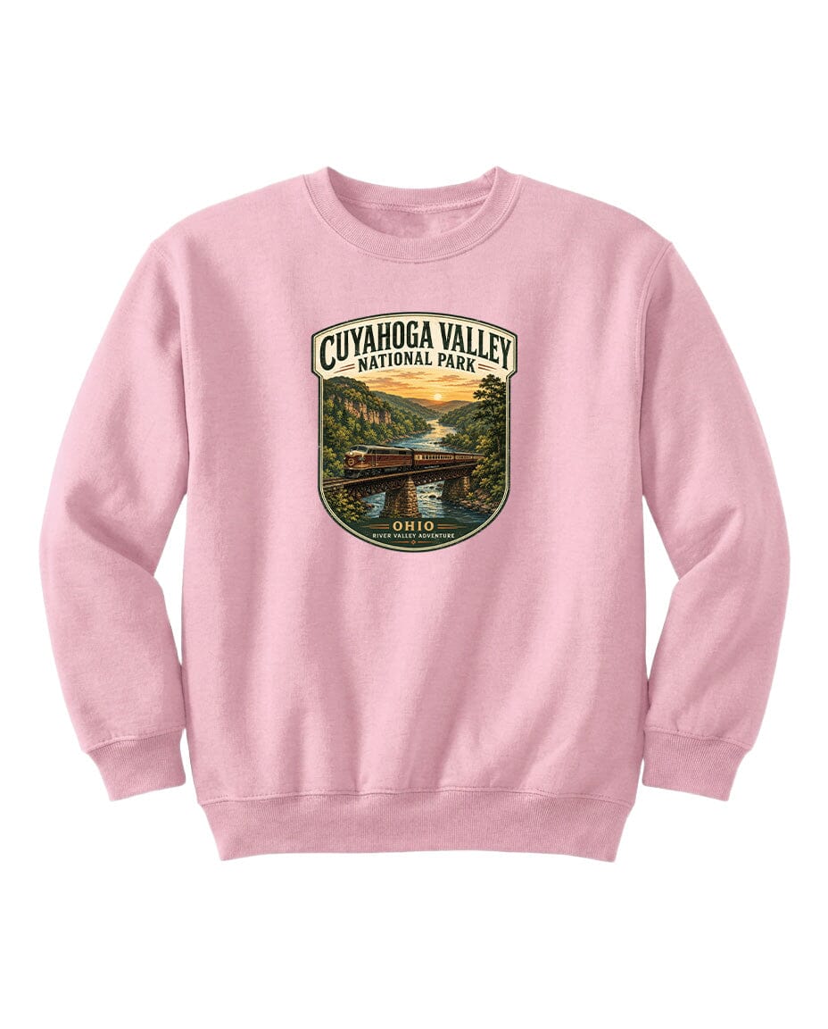 A pink sweatshirt with a graphic design depicting a scenic view of the Cuyahoga Valley National Park in Ohio.