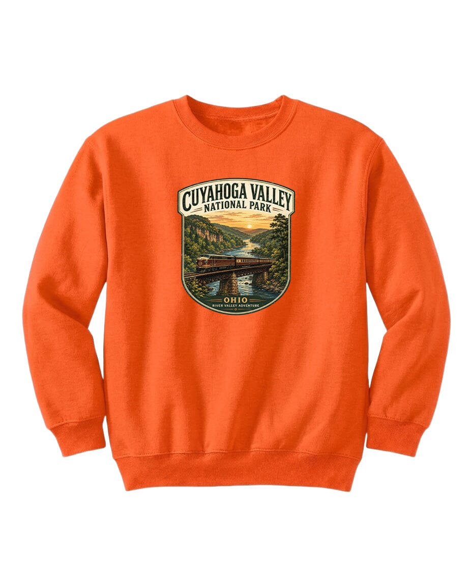 An orange sweatshirt with a graphic design depicting a scenic view of the Cuyahoga Valley National Park in Ohio.