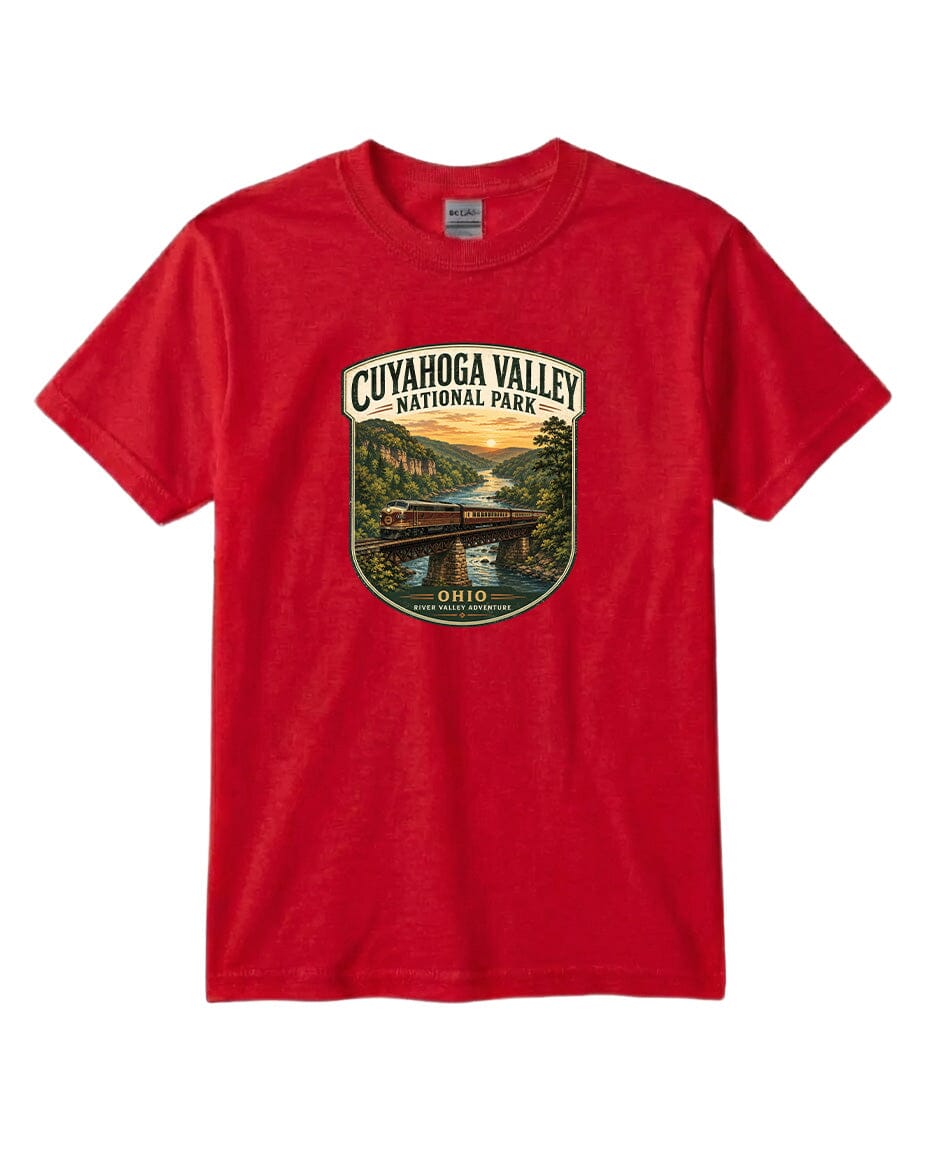 A red t-shirt with a graphic design depicting a scenic view of the Cuyahoga Valley National Park, featuring a bridge and a river.