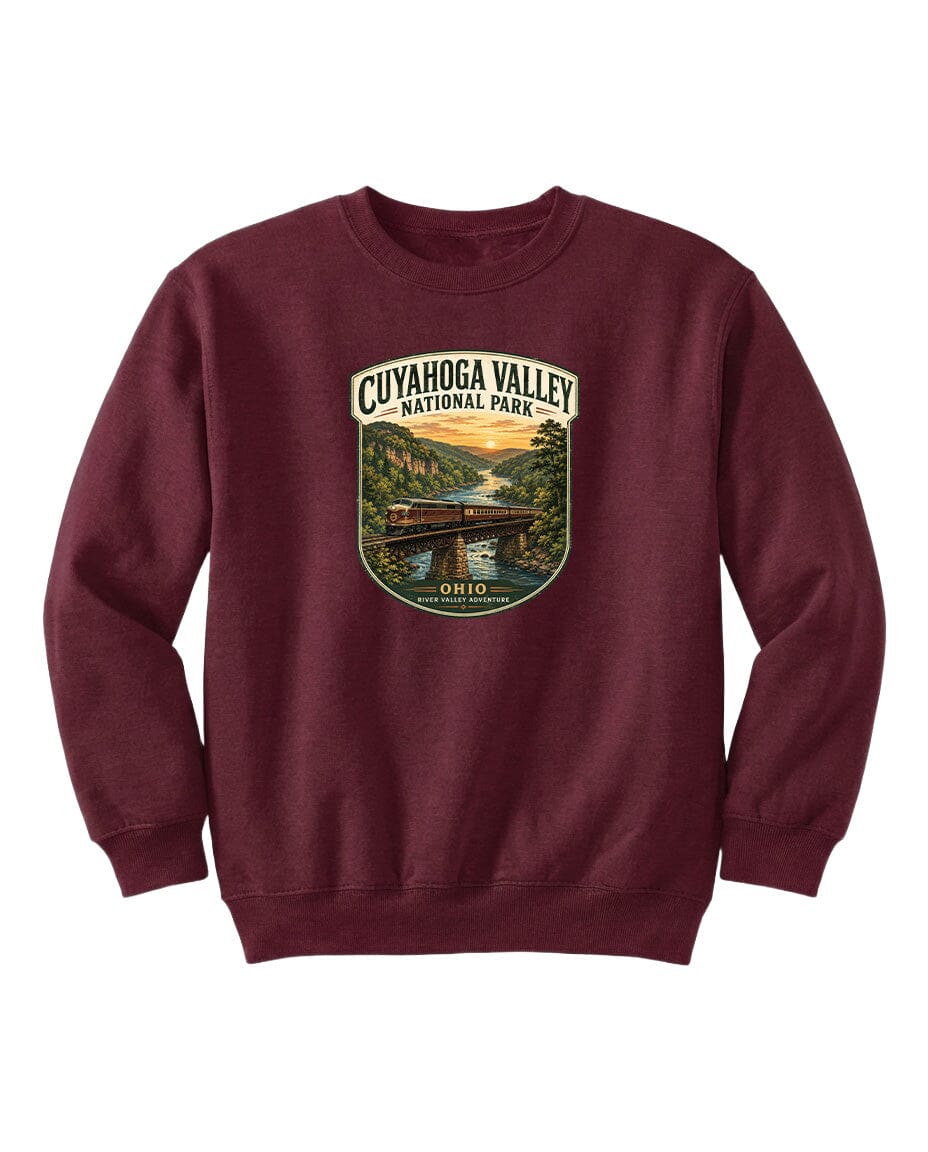 A burgundy sweatshirt with a graphic design depicting a scenic view of the Cuyahoga Valley National Park in Ohio.